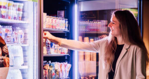 Woman using vending machine